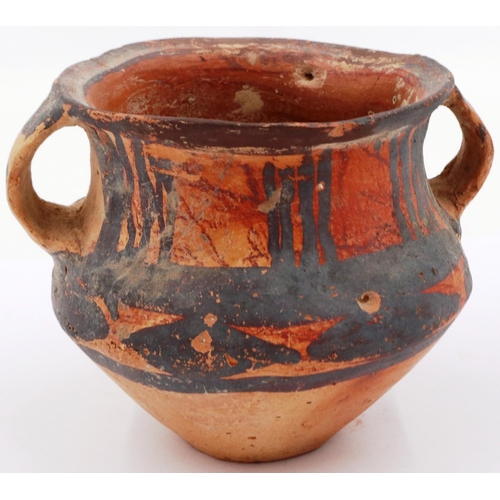 3047 - A Neolithic period painted terracotta twin handled pot, decorated with geometric designs, H: 8 cm, D... 