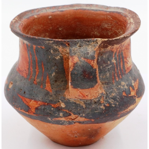 3047 - A Neolithic period painted terracotta twin handled pot, decorated with geometric designs, H: 8 cm, D... 