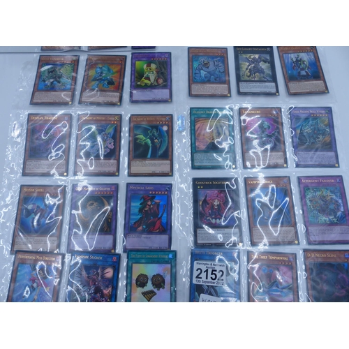 2152 - Large collection of Yu-Gi-Oh! items to include nine boxes and folders of sort after cards. P&P Group... 