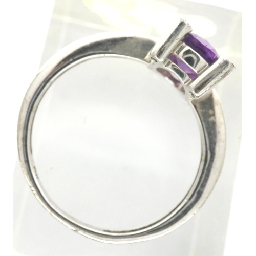 13 - 9ct white gold dress ring set with an amethyst and four diamonds, size I/J, 1.6g. P&P Group 1 (£14+V... 