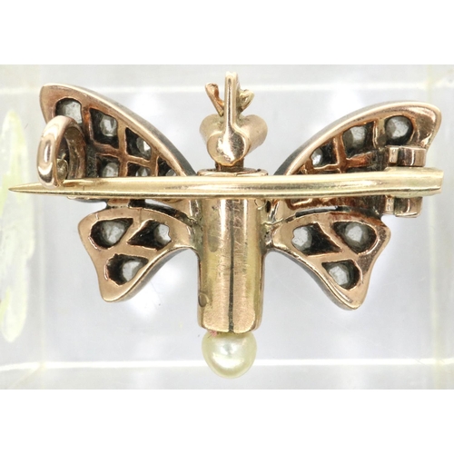 39 - Georgian (presumed, unmarked) 15ct gold butterfly form brooch, with garnet set eyes and diamond set ... 