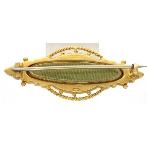 41 - Victorian 9ct gold mourning brooch, set with an amethyst and two seed pearls and having a glazed pan... 