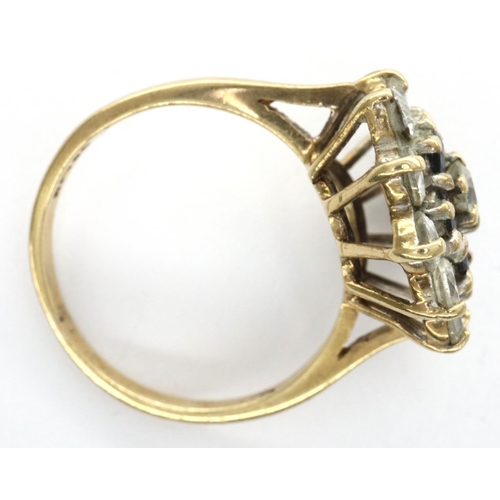 86 - 9ct gold sapphire and clear stone set cluster ring, size M/N, 3.5g. P&P Group 1 (£14+VAT for the fir... 