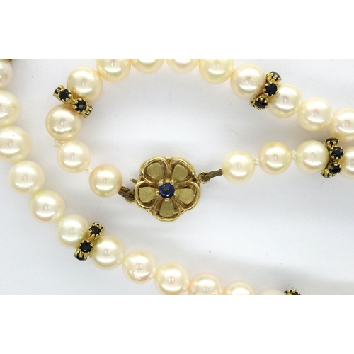 95 - Modern pearl choker with 9ct gold clasp and sapphire and gold spacers, L: 40 cm. Good order througho... 