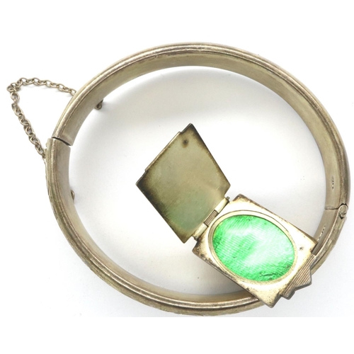 115 - An Art Deco silver locket, unusually top-hinged with a single photograph panel, together with a Char... 