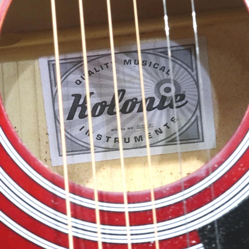 406 - Kolonie acoustic guitar in red and black. P&P Group 3 (£25+VAT for the first lot and £5+VAT for subs... 