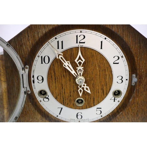 423 - Oak cased Enfield clock/Westminster chime mantel clock, H: 27 cm, working at lotting. Not available ... 