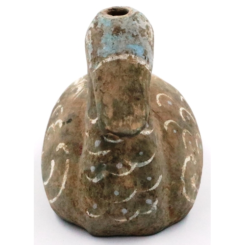 3051 - A Han Dynasty zoomorphic candle holder in the form of a duck, still retaining most of its polychrome... 