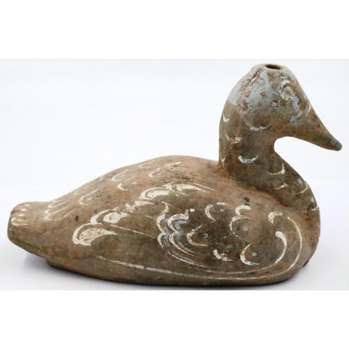 3051 - A Han Dynasty zoomorphic candle holder in the form of a duck, still retaining most of its polychrome... 