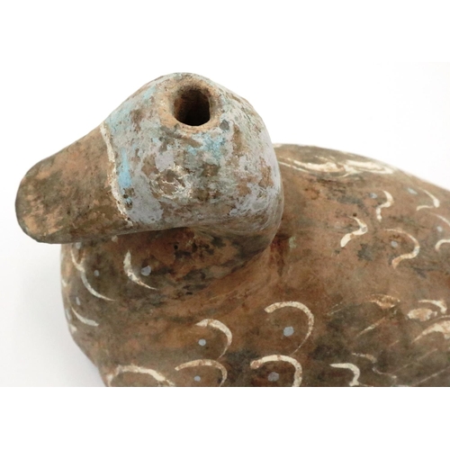 3051 - A Han Dynasty zoomorphic candle holder in the form of a duck, still retaining most of its polychrome... 