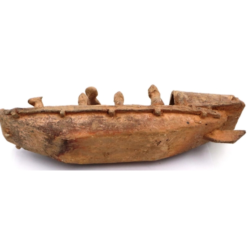 3052 - A rare Eastern Han Dynasty pottery boat, having six seated figures (one detached but present) and tw... 