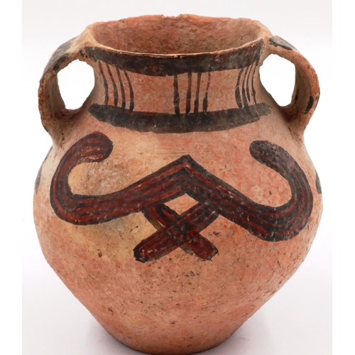 3053 - A Chinese Neolithic period urn, retaining almost all of its polychrome decoration and having two han... 