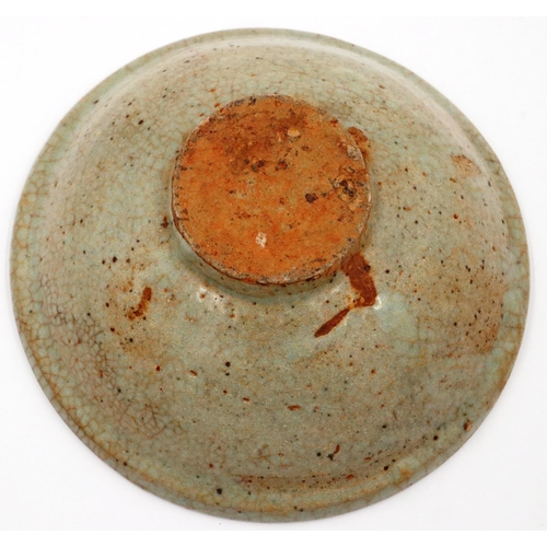 3056 - A Song Dynasty glazed bowl, near celadon in colour, D: 16 cm, H: 6 cm. Some chips to the rim and min... 