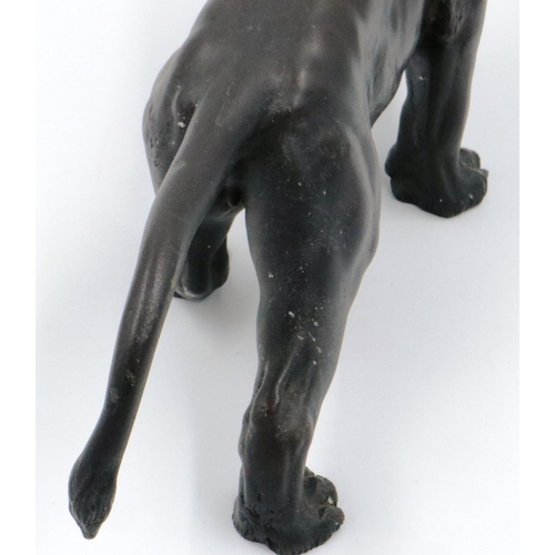 3066 - A Japanese Meiji period cast bronze figure of a lion, with impressed seal mark to its belly, L: 45 c... 