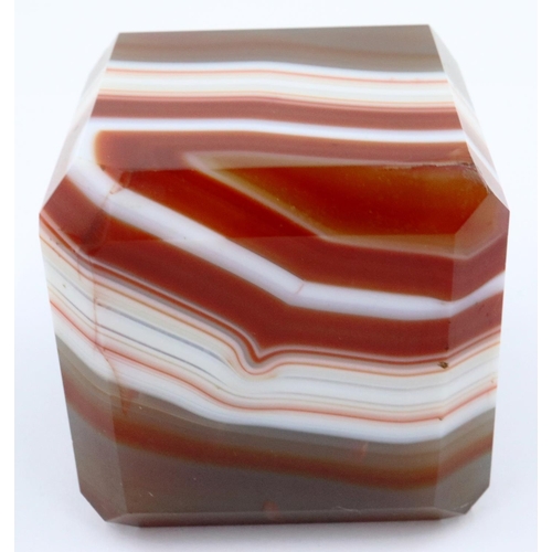 3071 - A heavily banded polished chuyu red agate cube, having chamfered edges, 5 x 5 x 5 cm. P&P Group 2 (£... 