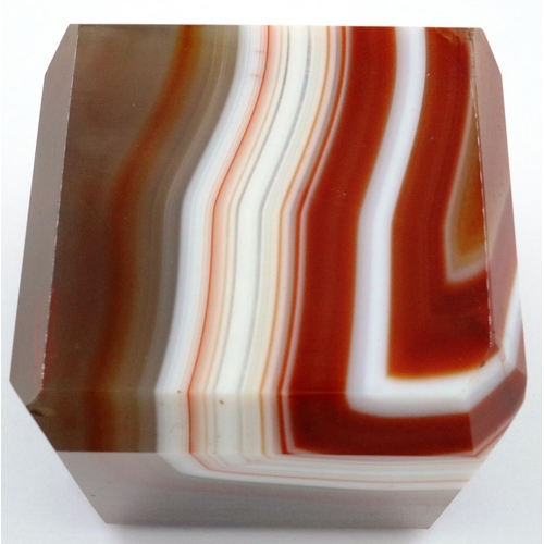 3071 - A heavily banded polished chuyu red agate cube, having chamfered edges, 5 x 5 x 5 cm. P&P Group 2 (£... 