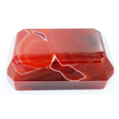 3074 - A banded and polished chuyu red agate block, with bevelled edges and of tapering form, 9 x 5.5 x 3 c... 