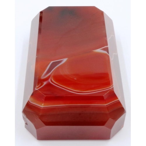 3074 - A banded and polished chuyu red agate block, with bevelled edges and of tapering form, 9 x 5.5 x 3 c... 