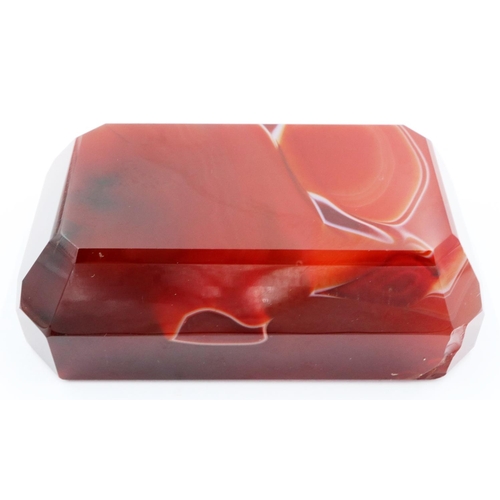 3074 - A banded and polished chuyu red agate block, with bevelled edges and of tapering form, 9 x 5.5 x 3 c... 