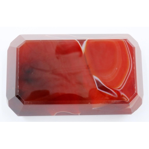 3074 - A banded and polished chuyu red agate block, with bevelled edges and of tapering form, 9 x 5.5 x 3 c... 