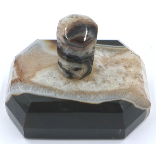 3081 - A banded and laced brown manao agate paperweight, being a tapering block surmounted with an octagona... 