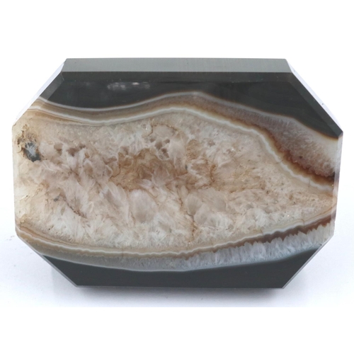 3081 - A banded and laced brown manao agate paperweight, being a tapering block surmounted with an octagona... 