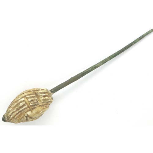 114D - Bronze Age Eastern hair pin with religious deity, L: 120 mm. P&P Group 0 (£5+VAT for the first lot a... 