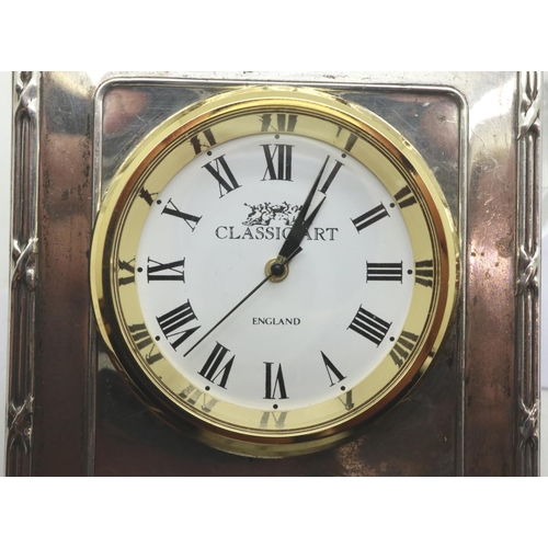 148 - Hallmarked silver mantel clock with movement, H: 65 mm, 59g. P&P Group 1 (£14+VAT for the first lot ... 