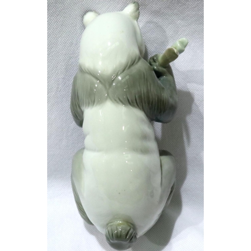 158 - Nao panda eating bamboo, H: 19 cm. No cracks, chips or visible restoration, glazing is in good condi... 