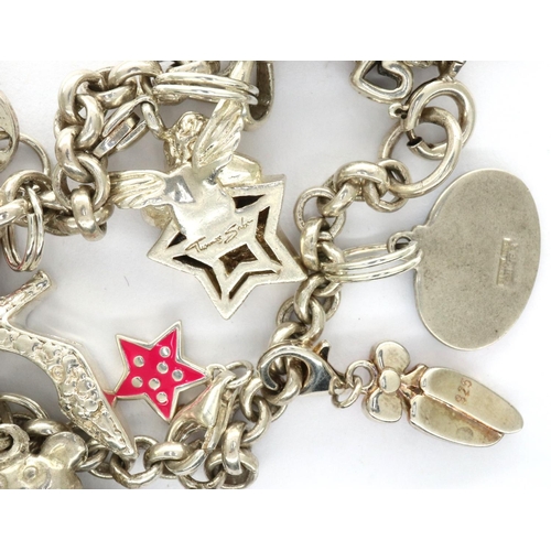 43 - 925 silver charm bracelet with twelve charms, L: 17 cm, combined 28g. P&P Group 1 (£14+VAT for the f... 