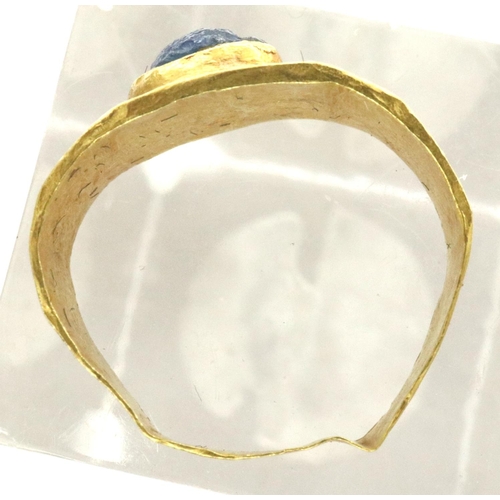 87 - Medieval ring set with a blue stone, 2.0g. We estimate it to be a size F/G but it is misshapen. P&P ... 