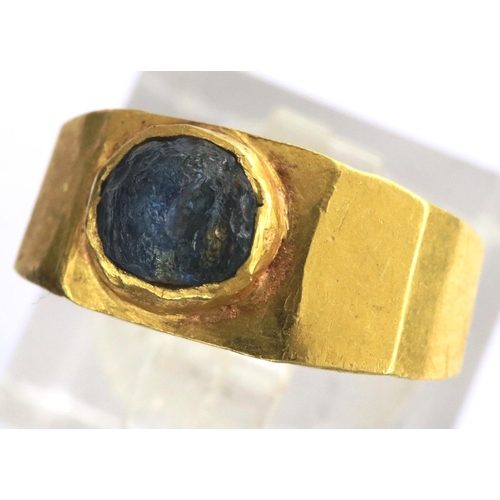 87 - Medieval ring set with a blue stone, 2.0g. We estimate it to be a size F/G but it is misshapen. P&P ... 