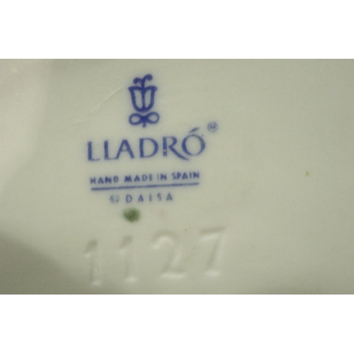 214 - Three Lladro figurines, largest H: 25 cm. No chips, cracks or visible restoration. P&P Group 3 (£25+... 