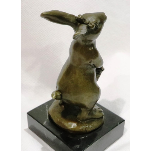 279 - Bronze rabbit holding flowers on a marble base, H: 14 cm. P&P Group 1 (£14+VAT for the first lot and... 