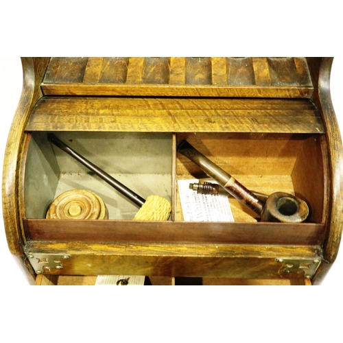 284 - Pipe smokers box with tambour front contents to include Meerschaum pipes, lacking pipe rack. P&P Gro... 