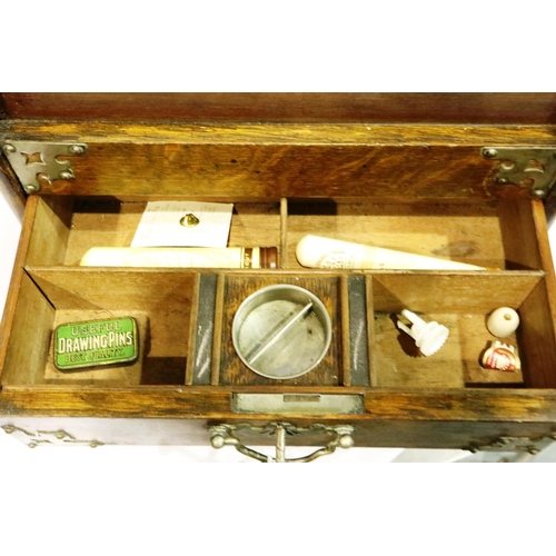 284 - Pipe smokers box with tambour front contents to include Meerschaum pipes, lacking pipe rack. P&P Gro... 