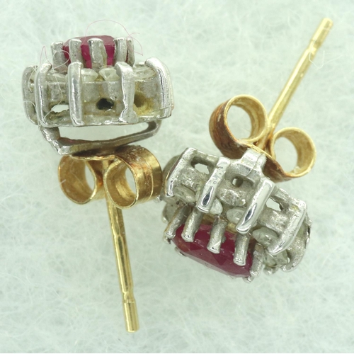 36A - Pair of 18ct gold ruby and diamond set cluster studs, combined 2.1g. All stones present, back presen... 