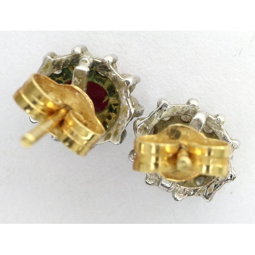 36A - Pair of 18ct gold ruby and diamond set cluster studs, combined 2.1g. All stones present, back presen... 