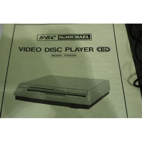 363 - GEC McMichael stereo video disc player model V5000H with seven discs, remote control, power supply a... 