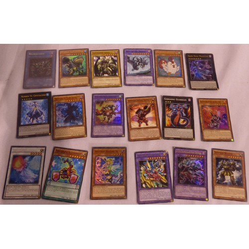 2180B - Small collection of sought after Yu-Gi-Oh! cards, some in plastic sleeves. P&P Group 1 (£14+VAT for ... 