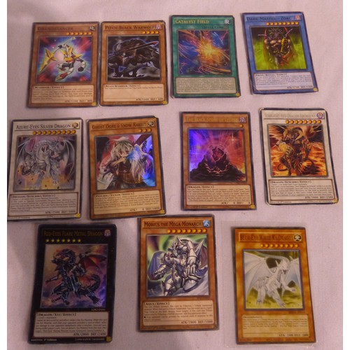 2180B - Small collection of sought after Yu-Gi-Oh! cards, some in plastic sleeves. P&P Group 1 (£14+VAT for ... 