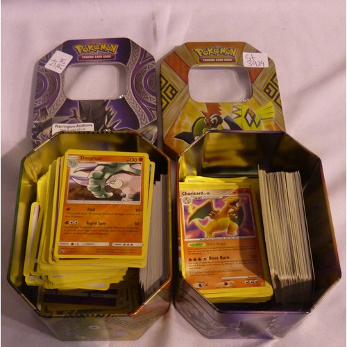 2180D - Two tins of assorted Pokémon cards. P&P Group 1 (£14+VAT for the first lot and £1+VAT for subsequent... 