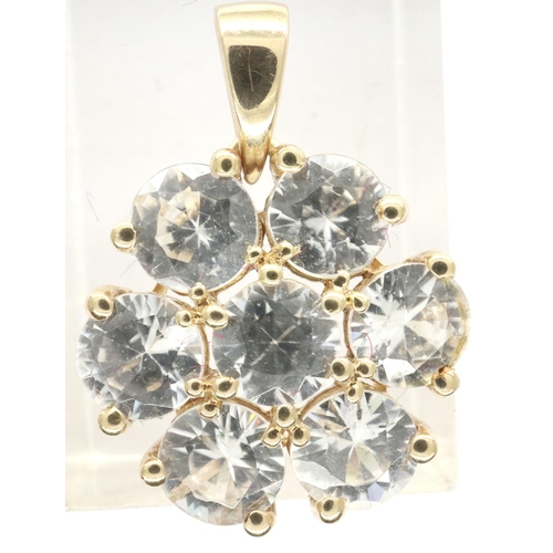 49 - 10ct gold flower pendant set with seven Topaz stones, L: 25 mm, 3.0g. P&P Group 1 (£14+VAT for the f... 