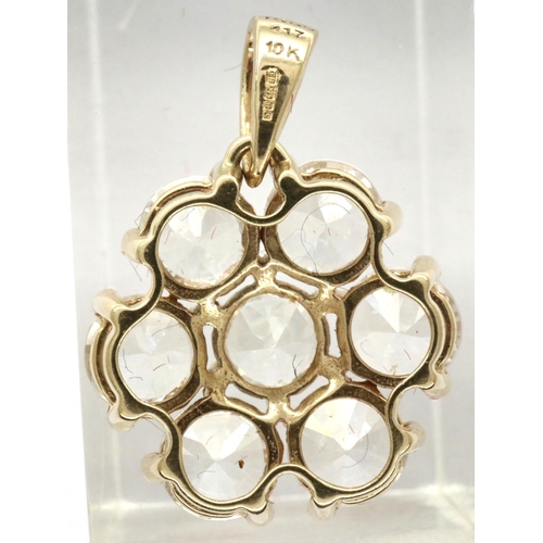 49 - 10ct gold flower pendant set with seven Topaz stones, L: 25 mm, 3.0g. P&P Group 1 (£14+VAT for the f... 