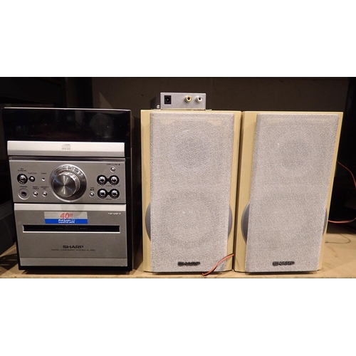 1018 - Sharp XL- E80 and a pair of Sharp speakers. All electrical items in this lot have been PAT tested fo... 