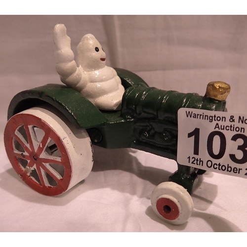 1033 - Cast iron Michelin Man on a tractor, H: 80 mm. P&P Group 1 (£14+VAT for the first lot and £1+VAT for... 