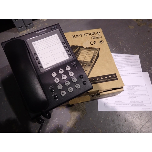 1059 - Black Panasonic KX-T7710E-B telephone in box. P&P Group 1 (£14+VAT for the first lot and £1+VAT for ... 