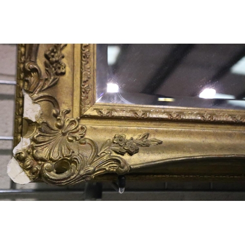 3042 - A 19th century gilt framed bevelled edge mirror, some losses to lower corners, 100 x 71 cm. Not avai... 