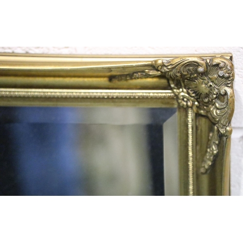 3044 - Large 20th century gilt framed bevelled edge mirror in good condition, 133 x 104 cm. Not available f... 