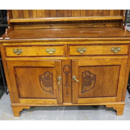 3095 - Art Nouveau cross banded dresser with two cupboards and two drawers with carved decoration by W.E Gr... 